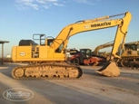 Side of used Komatsu Excavator in yard